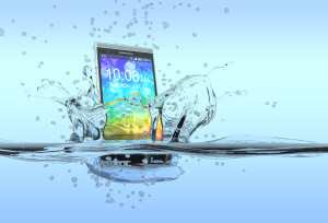 smartphone falling in water with splashes around it,